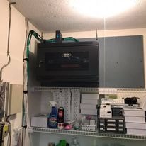 Network enclosure mounted in garage utility space