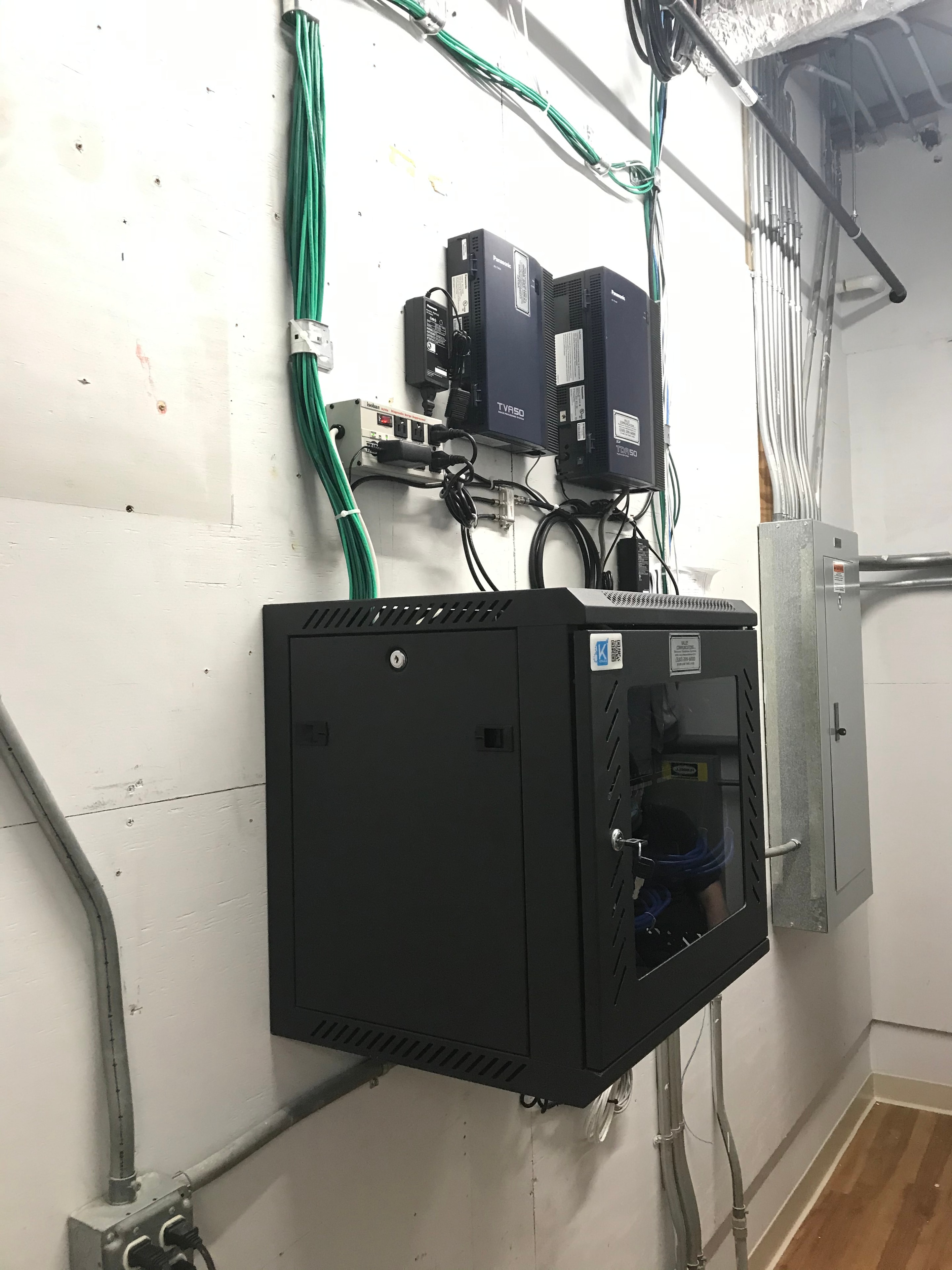 Network server cabinet with fiber optic and structured cabling installation